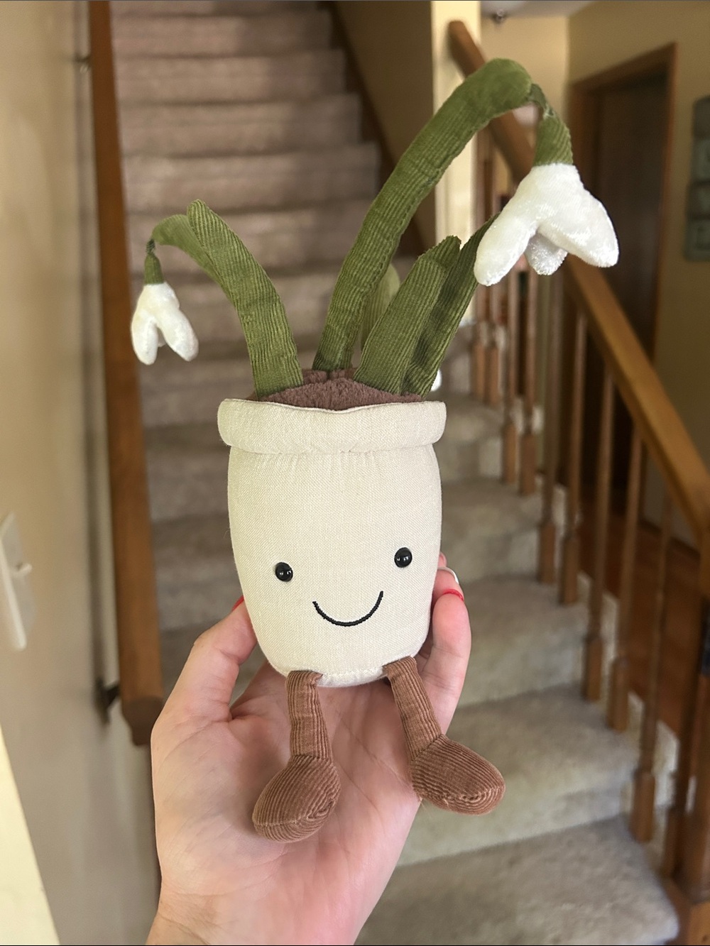Jellycat Beige Plush Toy with Red Nail Accent